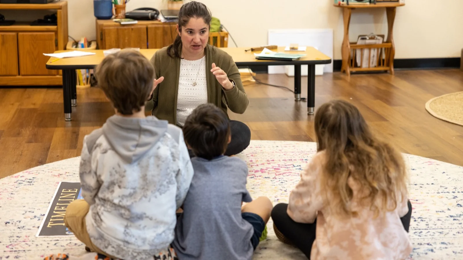 A San Tan Montessori guide leading a small-group classroom lesson at the Recker campus